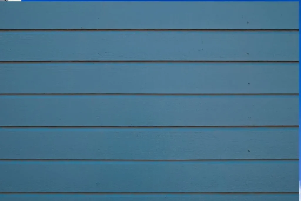 Blue painted horizontal lap siding boards reflecting hardie board siding cost calgary