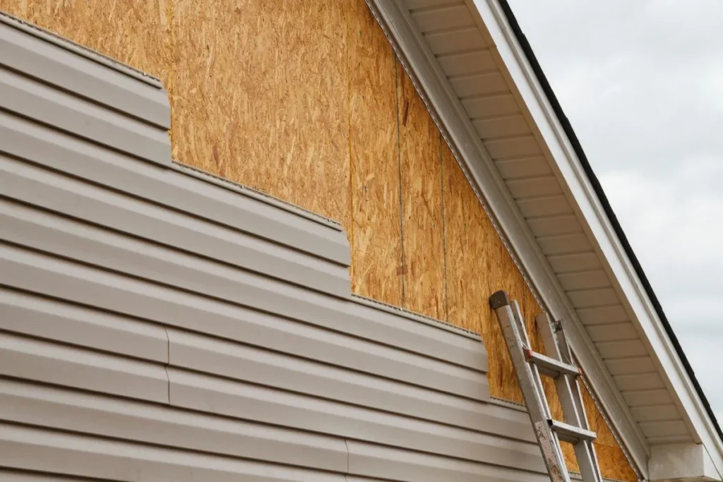 Siding replacement cost Calgary project with old siding removed exposing wall sheathing